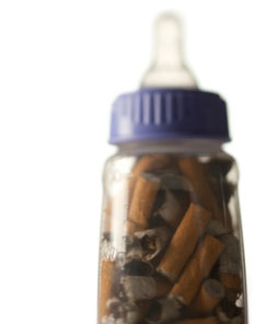 Baby bottle with cigarette butts